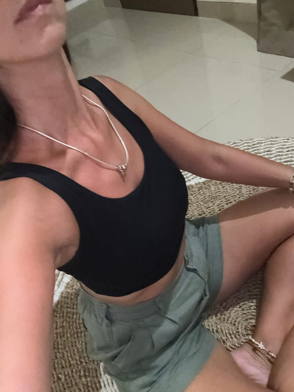 Person rests in black top in Kuta Selatan