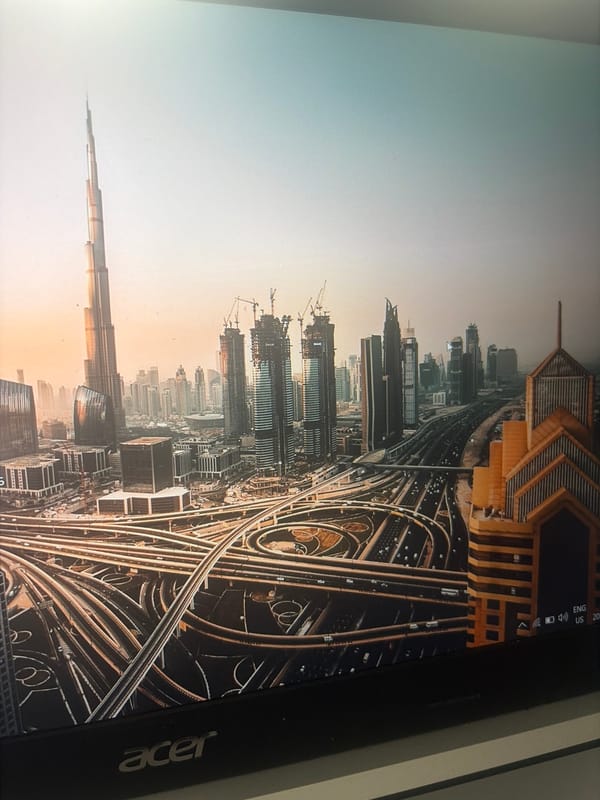 Computer monitor displays urban skyline photograph in Sofia