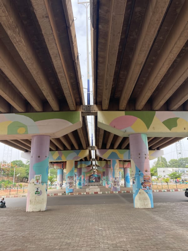 Decorated underpass in Jos captured during midday activity