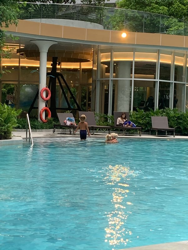 Resort pool morning: laps, leisure, and a solo lunch