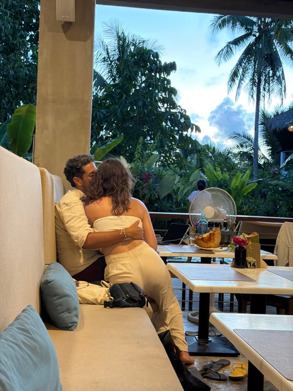 Couple shares intimate moment on outdoor seating in General Luna