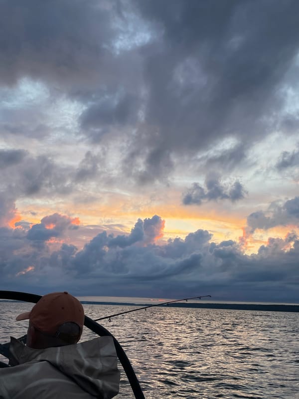 Fishing boat on stormy-sky evening waters near Yablonovka