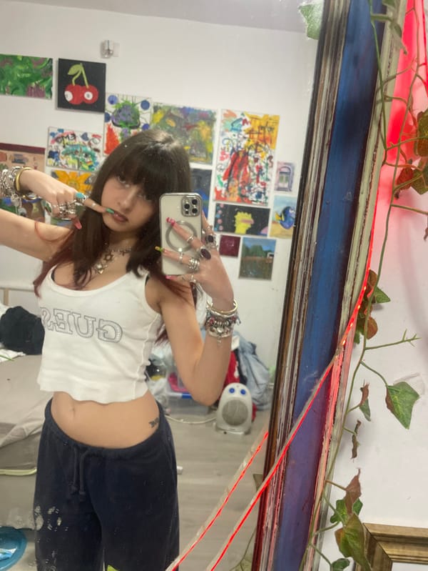 Young Woman Takes Mirror Selfies While Eating Candy in Raanana