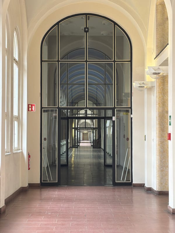 Berlin witness documents arched corridor with glass doorway perspective