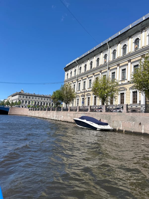 Canal boat tour through St. Petersburg on a clear summer morning