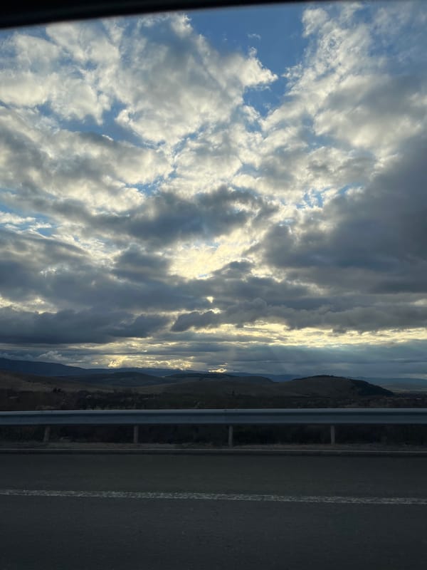 Driver uses GPS navigation system near Bulgarian mountains