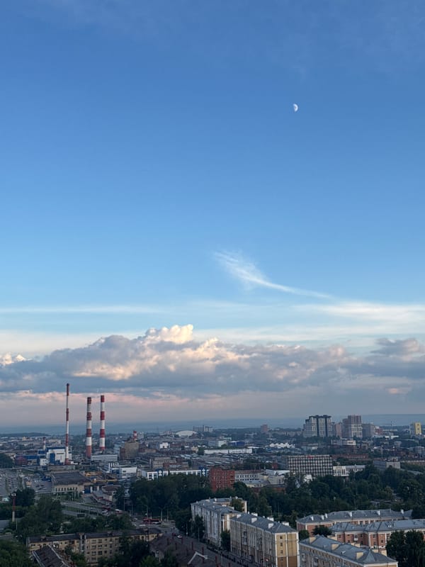 City skyline and dramatic skies shot from above at golden hour