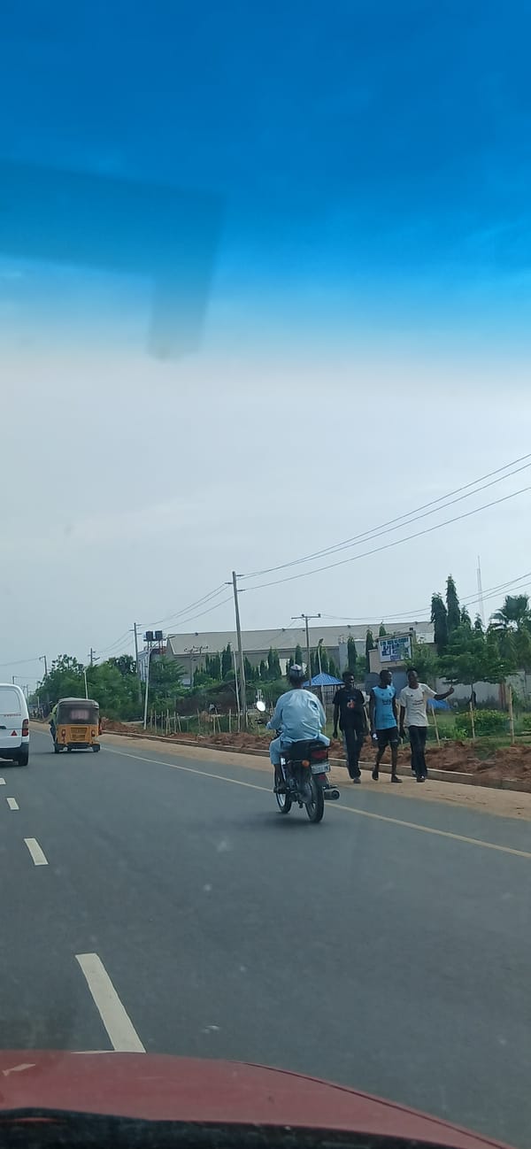Group of men observed roadside in Matage, Nigeria