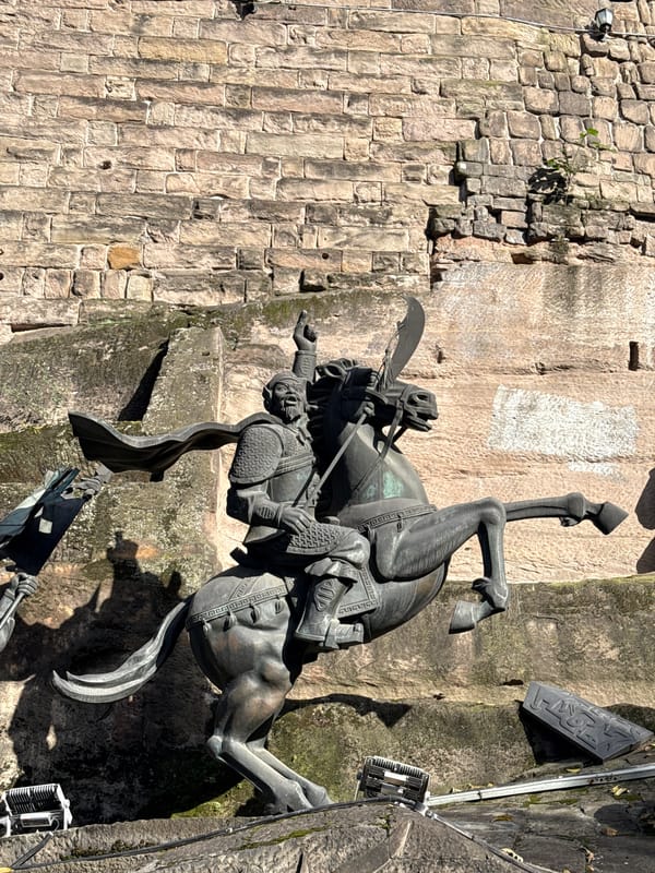 Daily life unfolds around ancient warrior sculptures in Chongqing