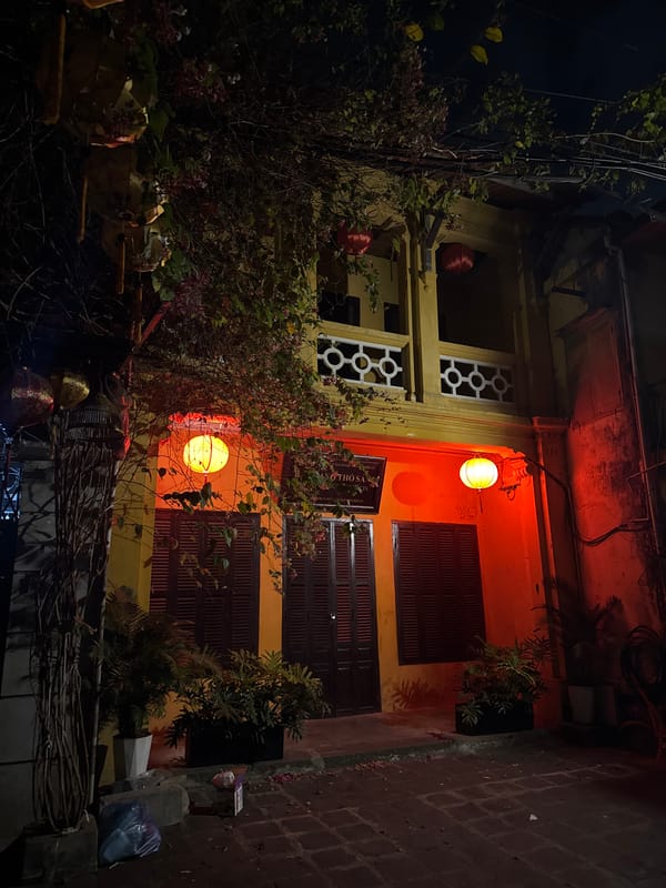 Traditional building illuminated by orange lanterns in Hội An