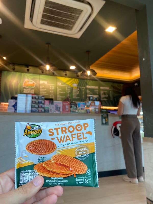 Customer holds stroopwafel package at Thailand cafe