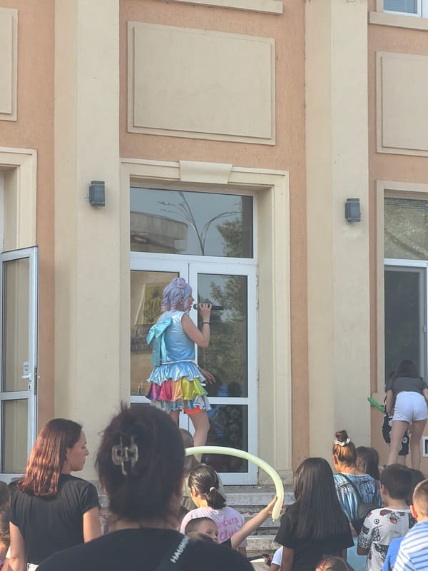 Community gathering with costumed performers outside Bulgarian cultural center