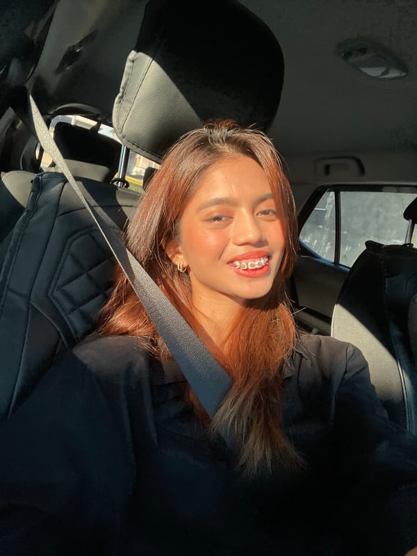 Woman takes selfies in car during morning drive
