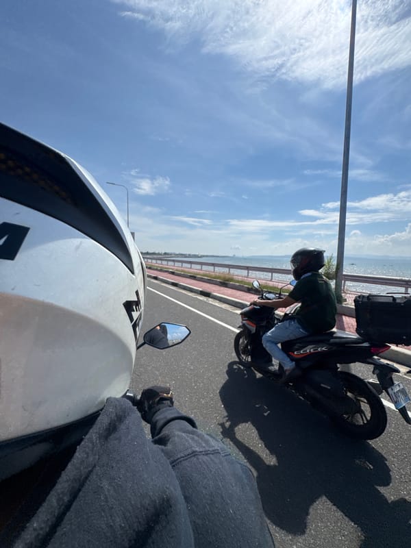 Motorcyclist rides Davao City coastal road in Philippines
