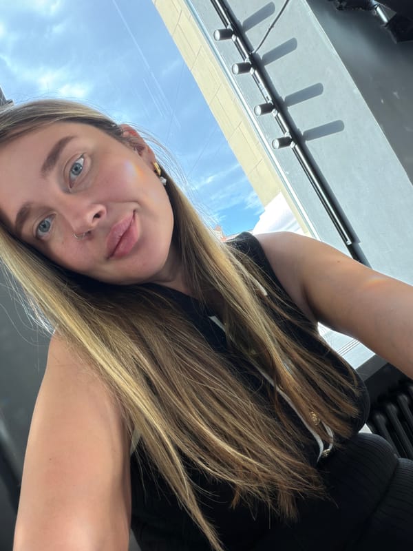 Woman takes selfies in Russian indoor spaces with decorative lighting