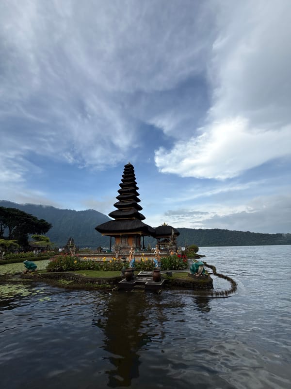 Tourist documents iconic Balinese temple complex at Lake Bratan