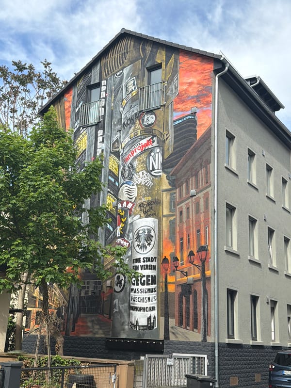 Street scene mural with German graffiti documented in Frankfurt