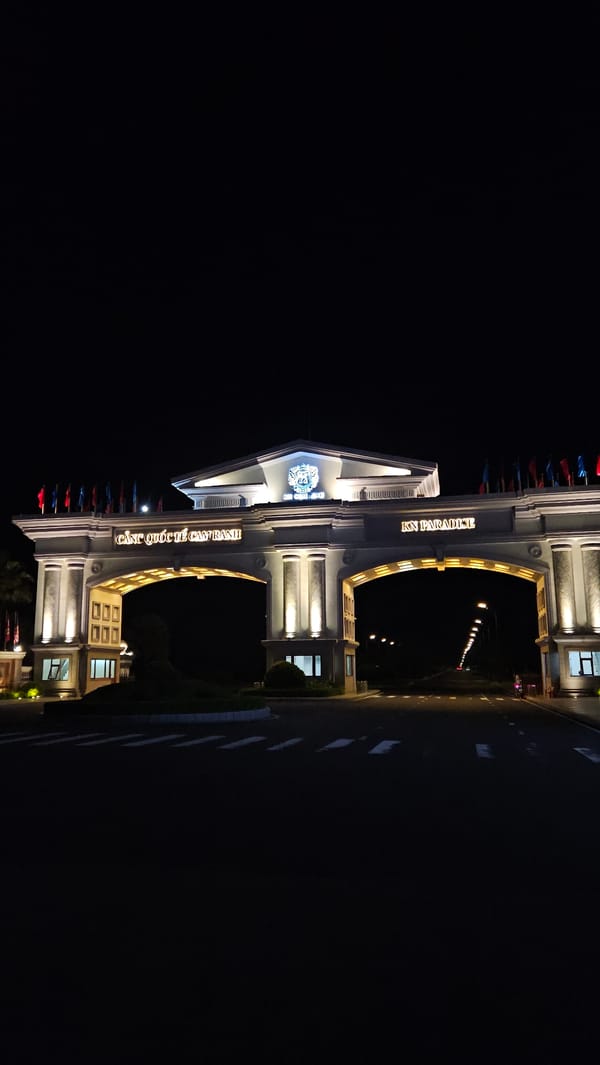 Illuminated architectural gate photographed at night in Bac Cam Ranh