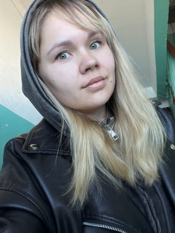Upside-down portrait of young blonde person photographed early morning