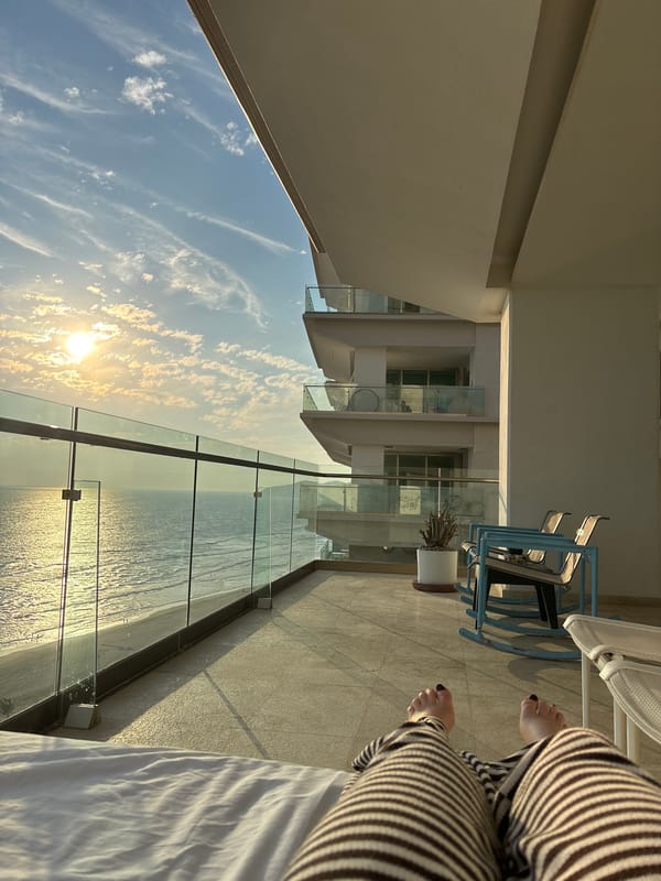 Hotel balcony sunset views captured over Acapulco coastline