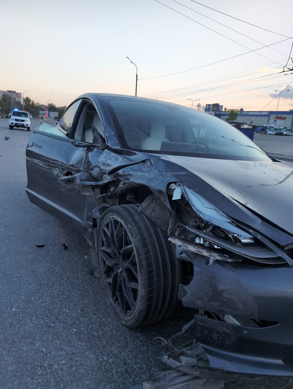 Car accident damages sedan on Izhevsk city street