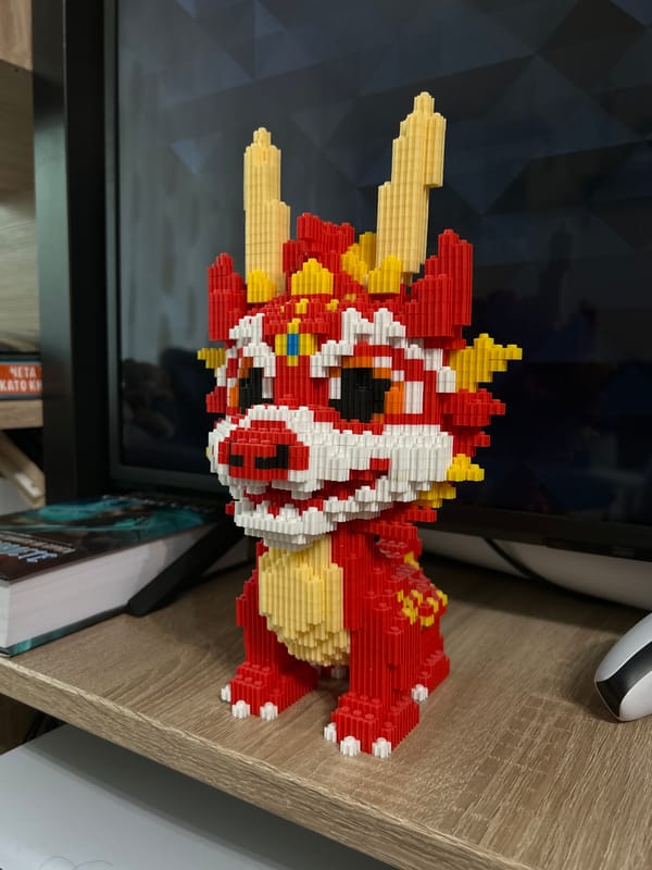 Colorful Lego dragon model spotted on wooden surface