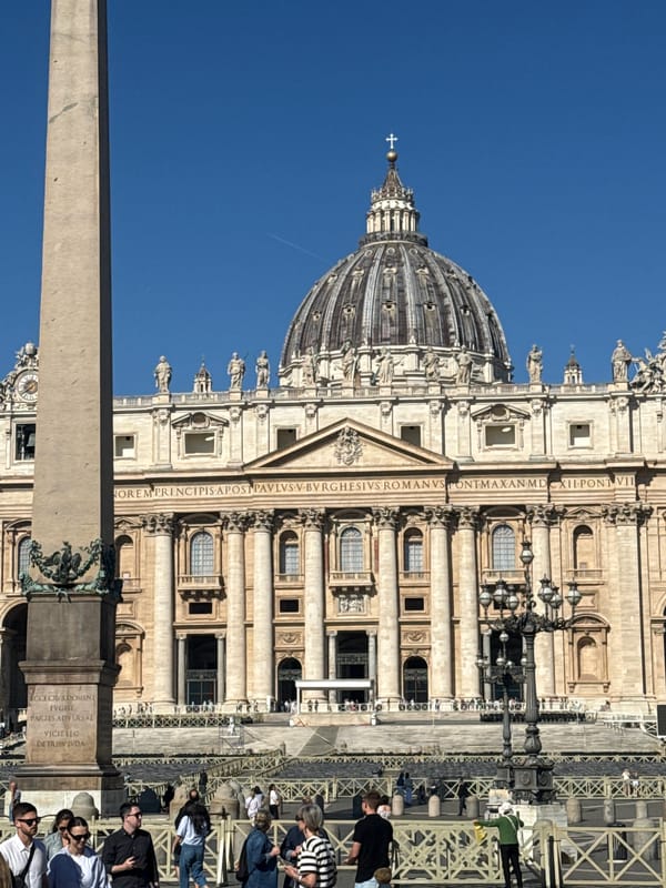 Morning documentation captures sunny St. Peter's Square with tourists