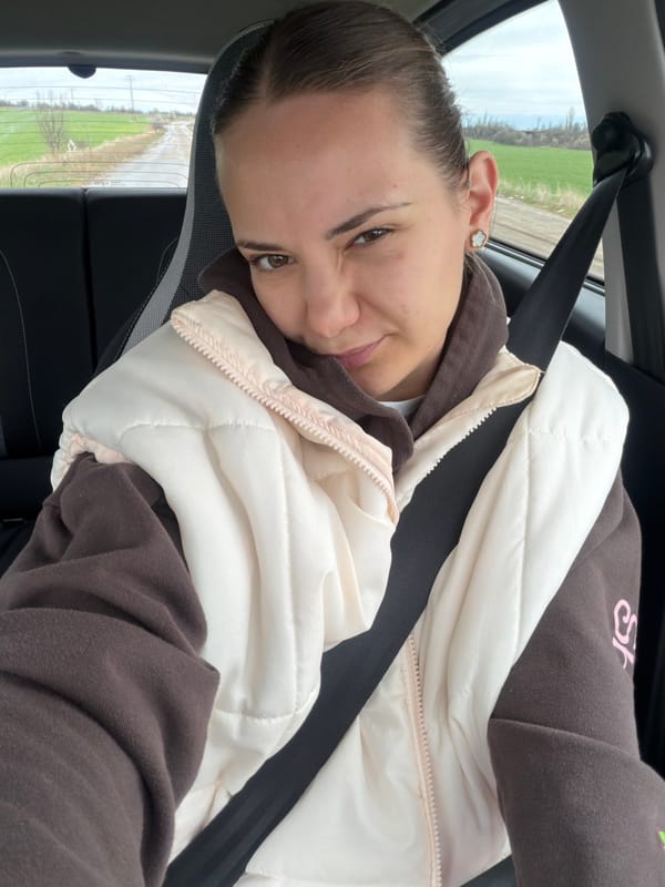 Woman photographed smiling in moving car in Sofia
