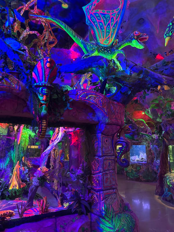 Tourist visits Yevpatoriya aquarium, documents marine exhibits and themed sculptures