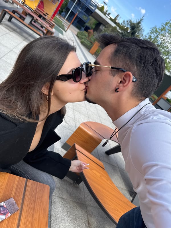 Couple shares intimate moment at Sofia McDonald's outdoor seating