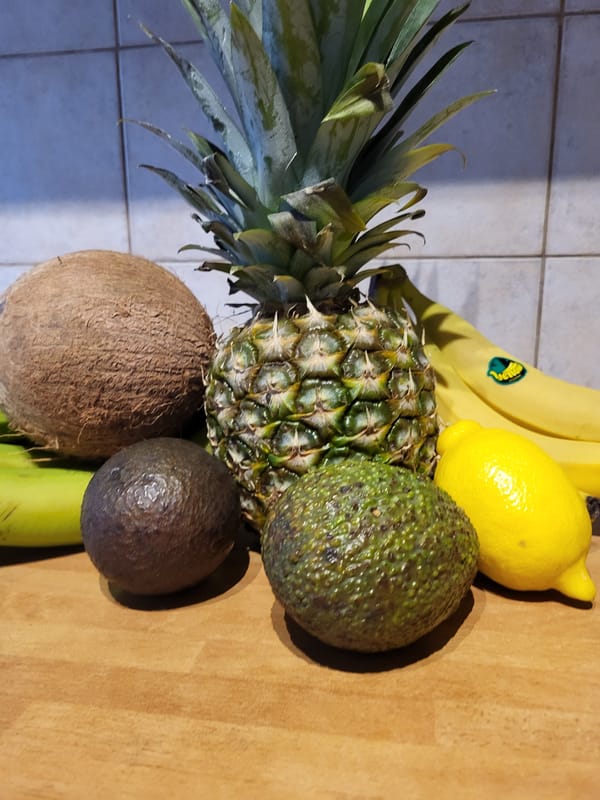 Kitchen tropical fruit prep session with coconut and pineapple