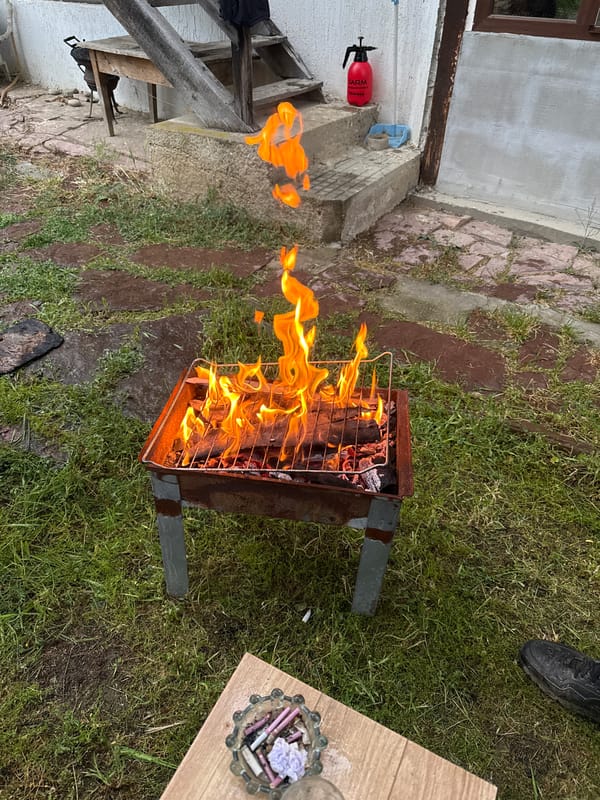 Backyard barbecue grill in use in Banya, Bulgaria