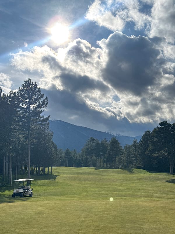 Golf course observed under sunny skies in Razlog, Bulgaria