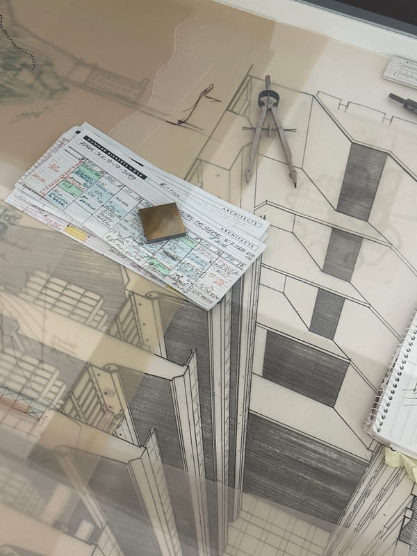 Architect sketches building plans overlooking Riga's historic riverfront