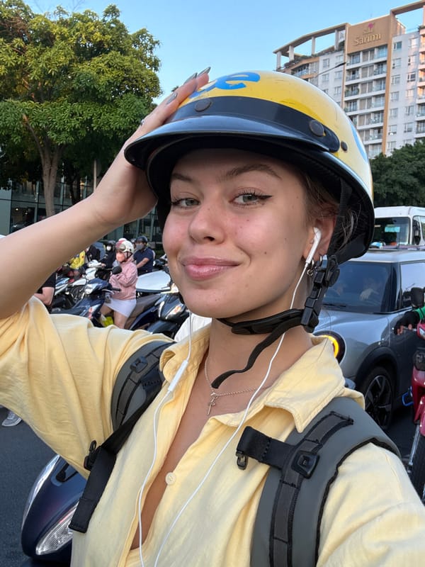 Tourist documents motorbike ride through busy Vietnam streets