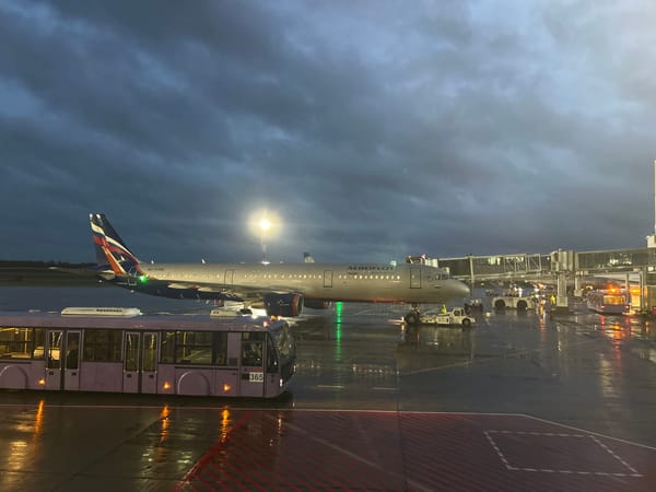 Aeroflot and Belavia aircraft on a rainy evening at Minsk Airport