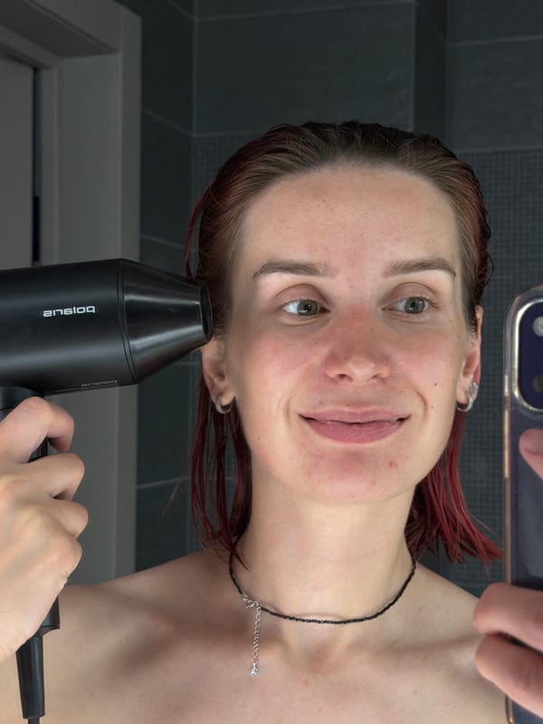 Woman Takes Bathroom Selfies While Drying Hair in Chaikovsky