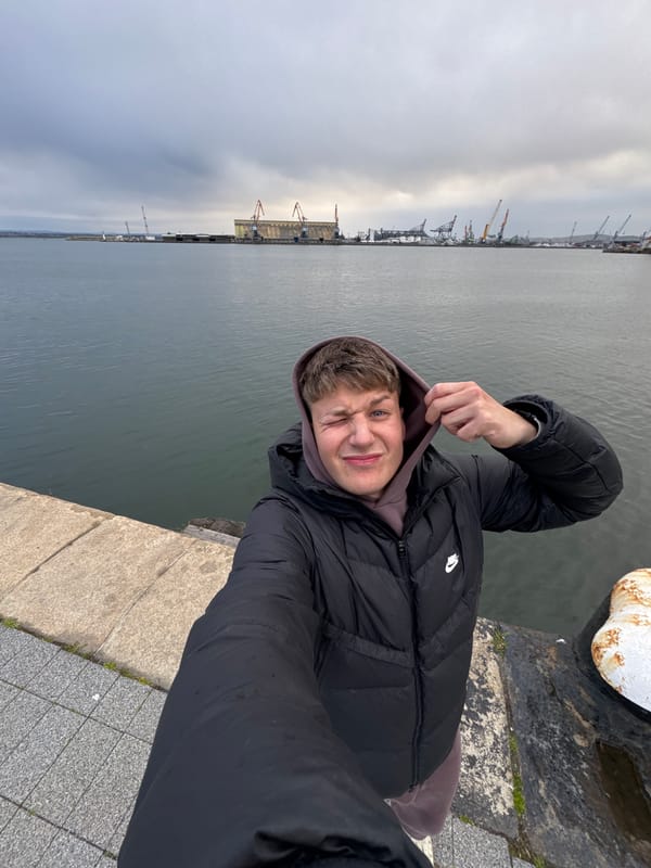 Fisherman spends rainy afternoon at Burgas harbor pier