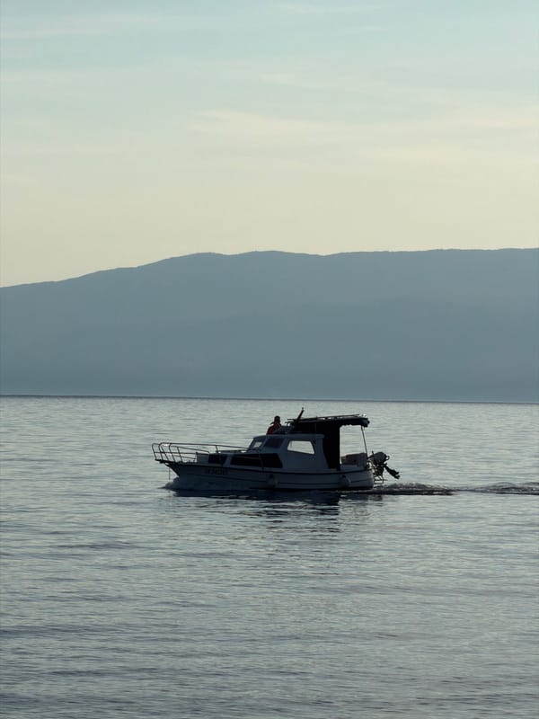 White boat spotted in calm waters near Rijeka, Croatia