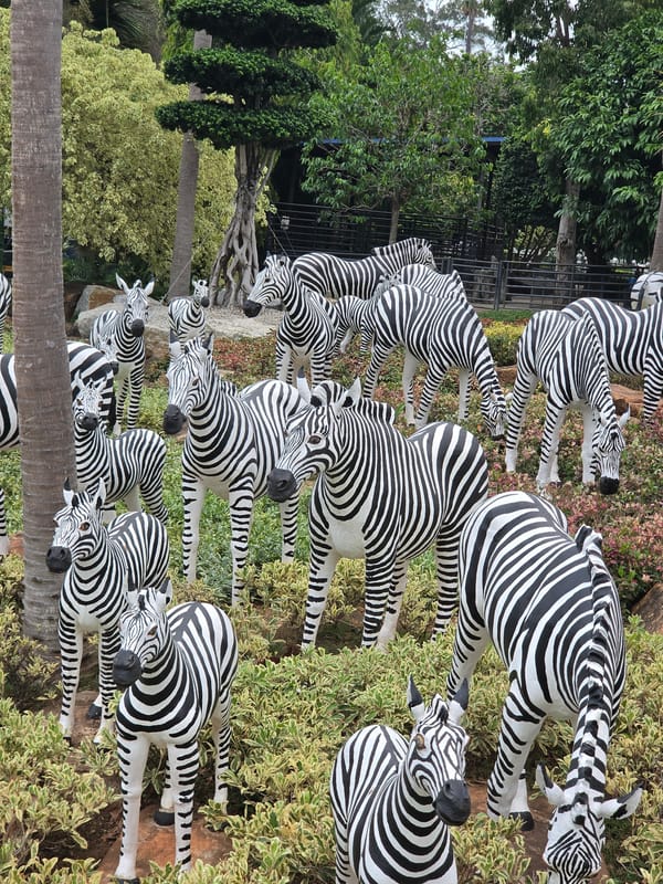 Animal sculpture displays documented at Thai tropical garden