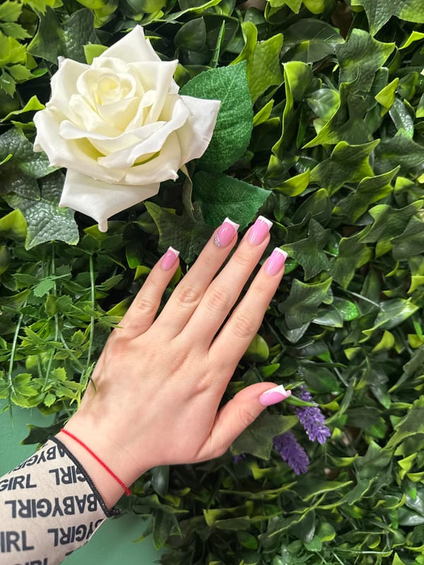 Manicured hand photographed with flowers in Burgas, Bulgaria