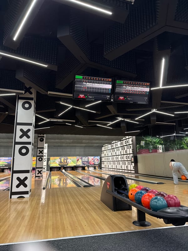 Friends bowl with pet poodle at Burgas entertainment venue