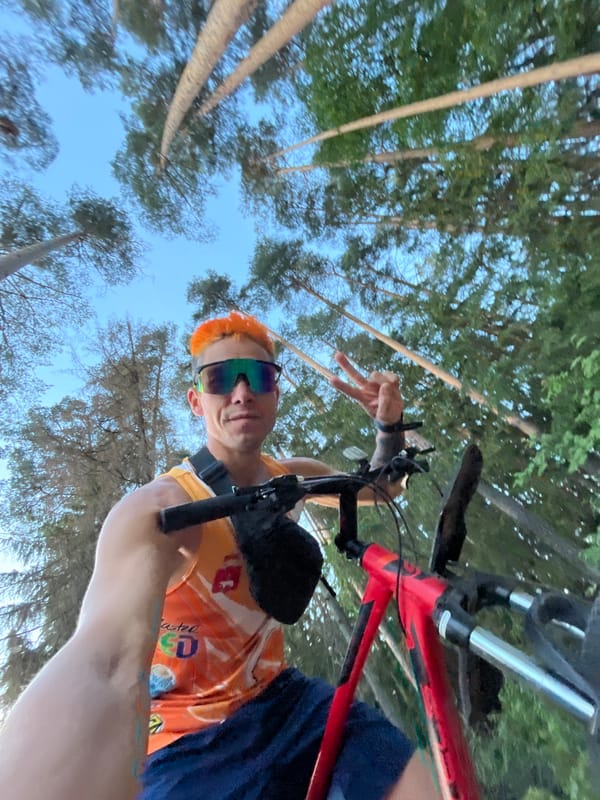 Orange-haired cyclist documents bike ride through Russian countryside