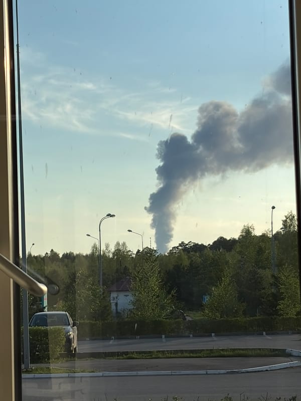 Dark smoke plume observed rising near residential area