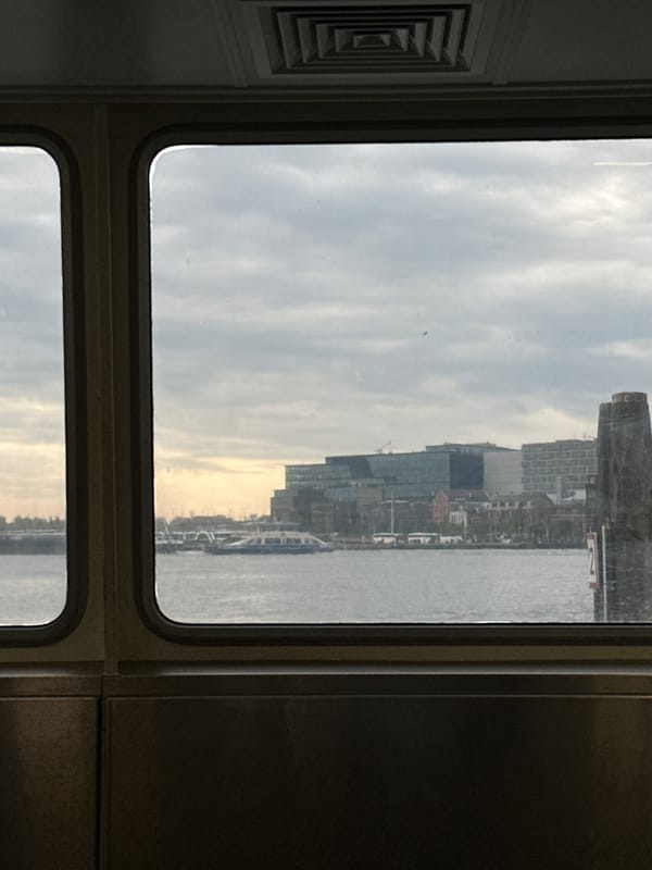 Morning commuter documents train journey through Amsterdam