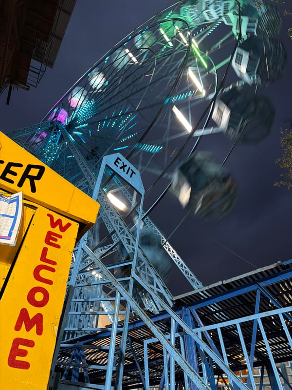 Illuminated Ferris wheel operates at night in Pokhara