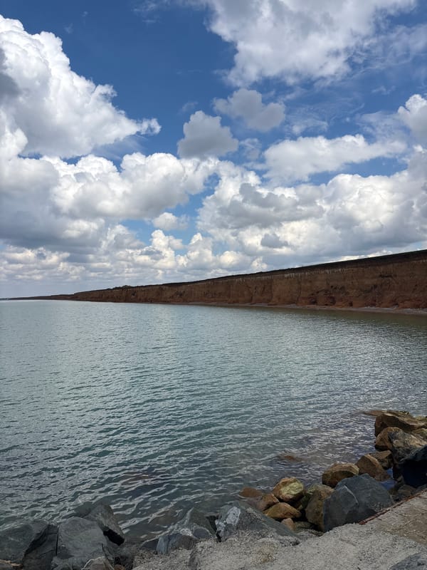 Orange Jeep spotted at Ukrainian cliff overlook near water