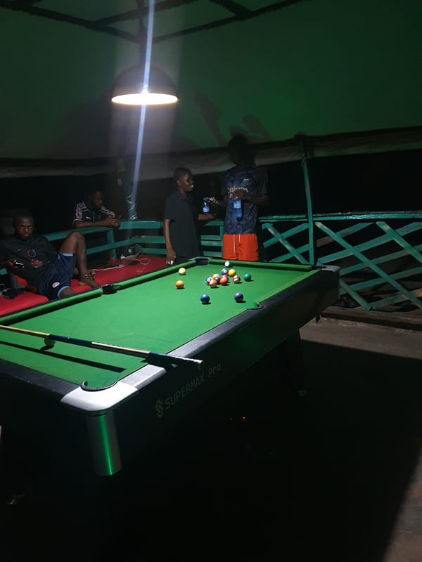 Evening pool game at outdoor recreational spot in Lokoja