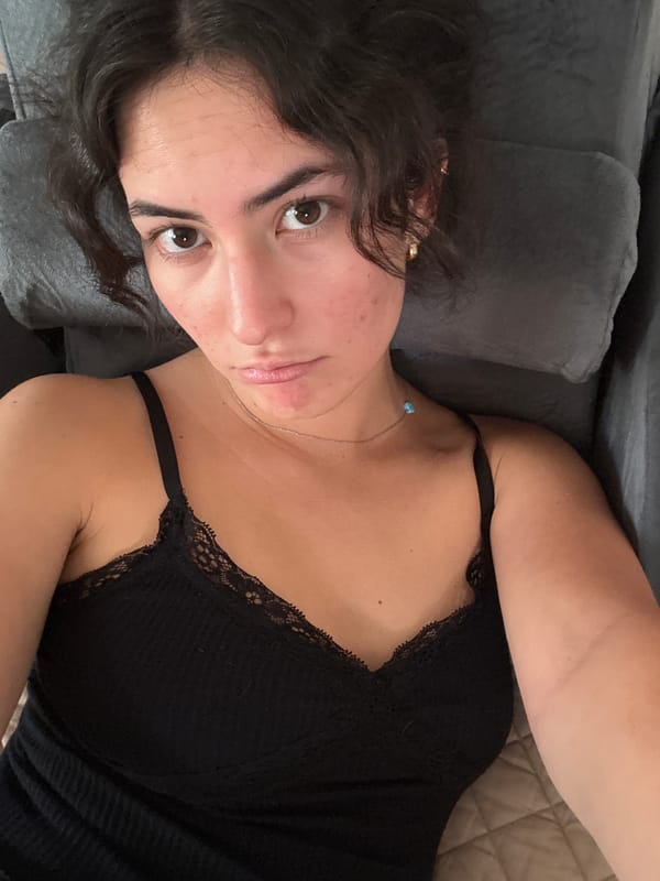 Woman rests on couch in Puebla home interior