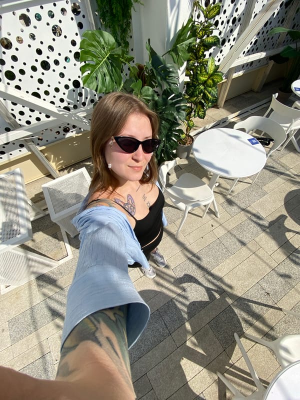 Woman takes morning selfie near Ferris wheel in Saratov